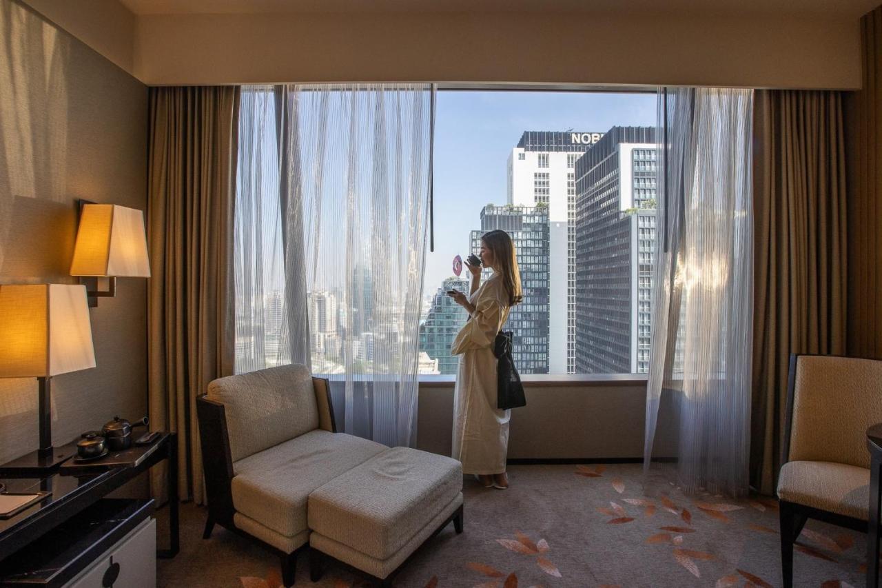 The Okura Prestige Bangkok Hotel Exterior photo A guest room at the hotel